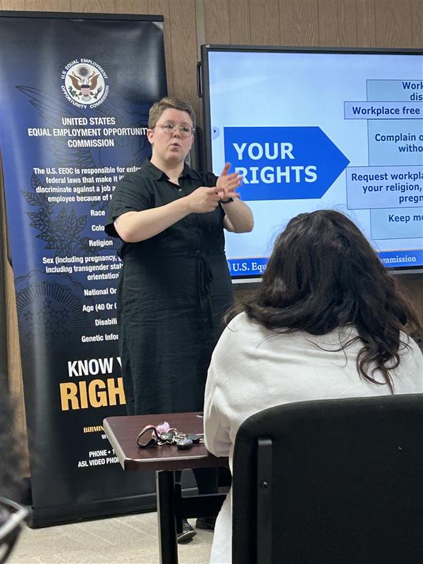 AIDB Birmingham Staff Interpreter Autumn Anderson interprets for a workshop on Employment Discrimination with Federal investigator Cortise Miles.